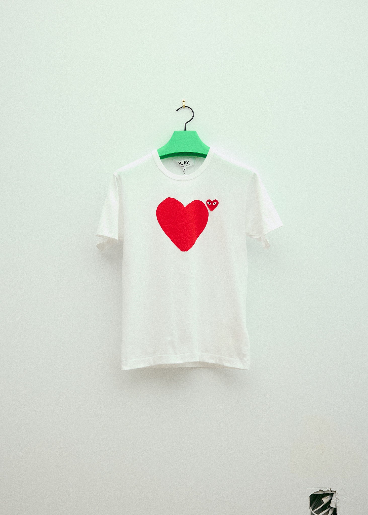 White t store shirt red heart